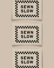 Load image into Gallery viewer, Sewn Slow Black Ivory Garment Labels